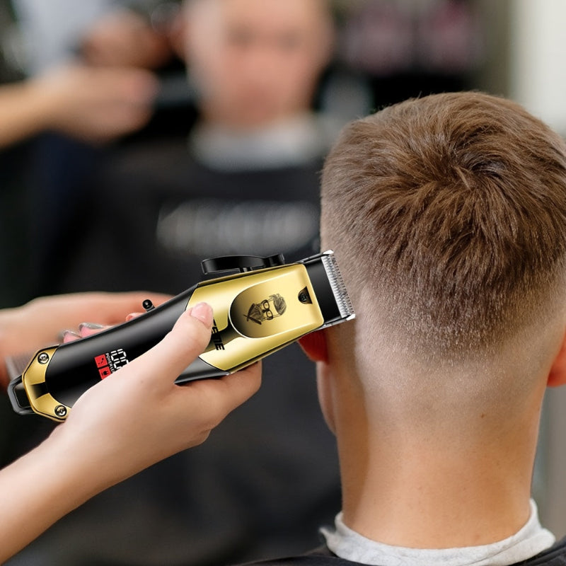 Person using a gold and black hair trimmer on another person's head.