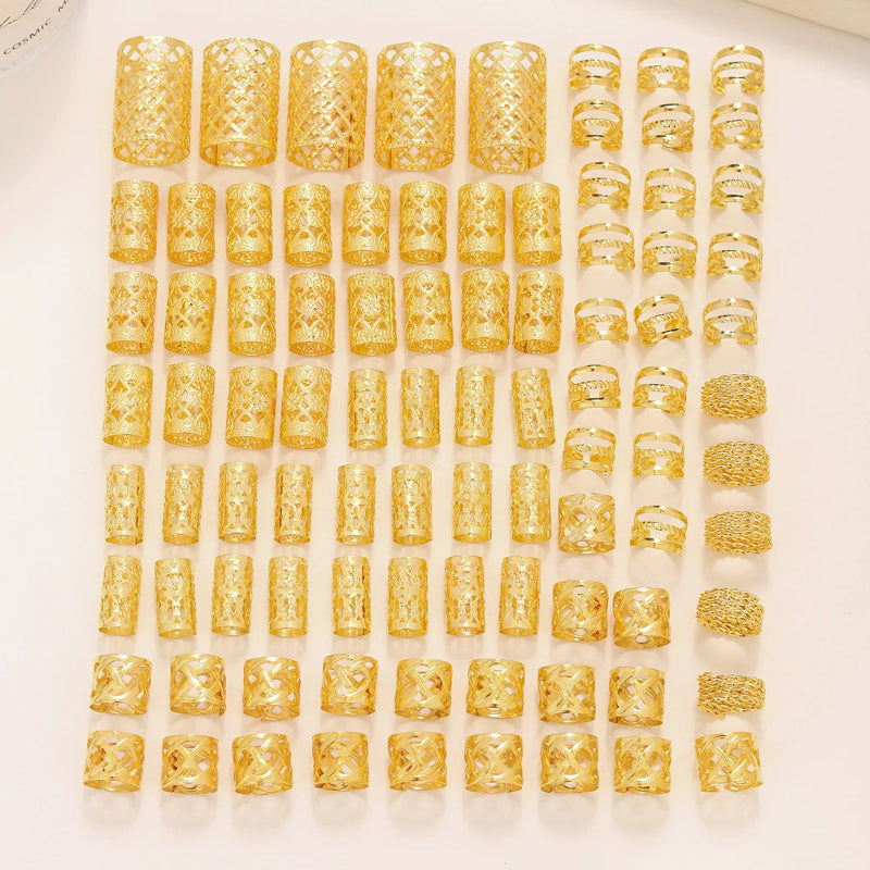 Multiple gold rings displayed on a white surface