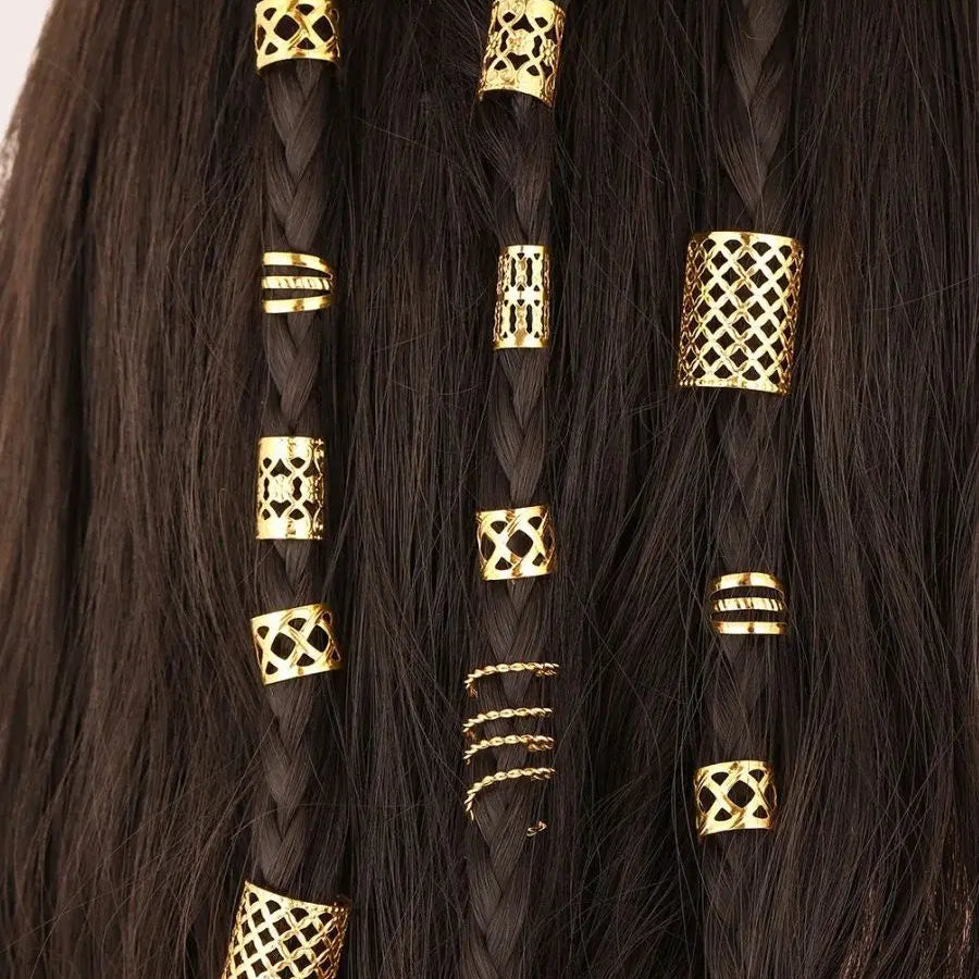 Black braided hair extensions with gold beads and decorative elements.