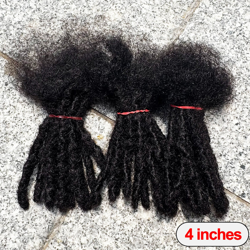 Three bundles of black hair extensions on a textured surface with a '4 inches' label.