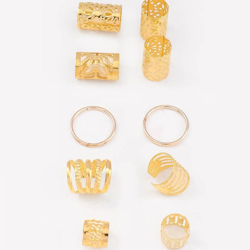 Set of gold rings with various designs on a white background