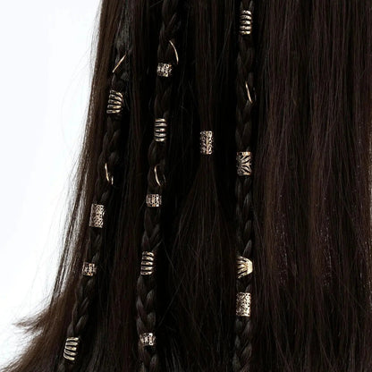 Close-up of braided hair extensions with decorative beads on a white background