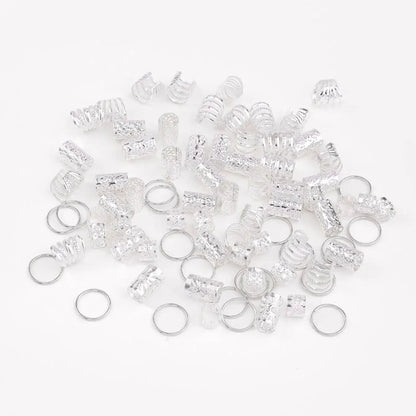 Collection of clear plastic rings with embedded rhinestones on a white background